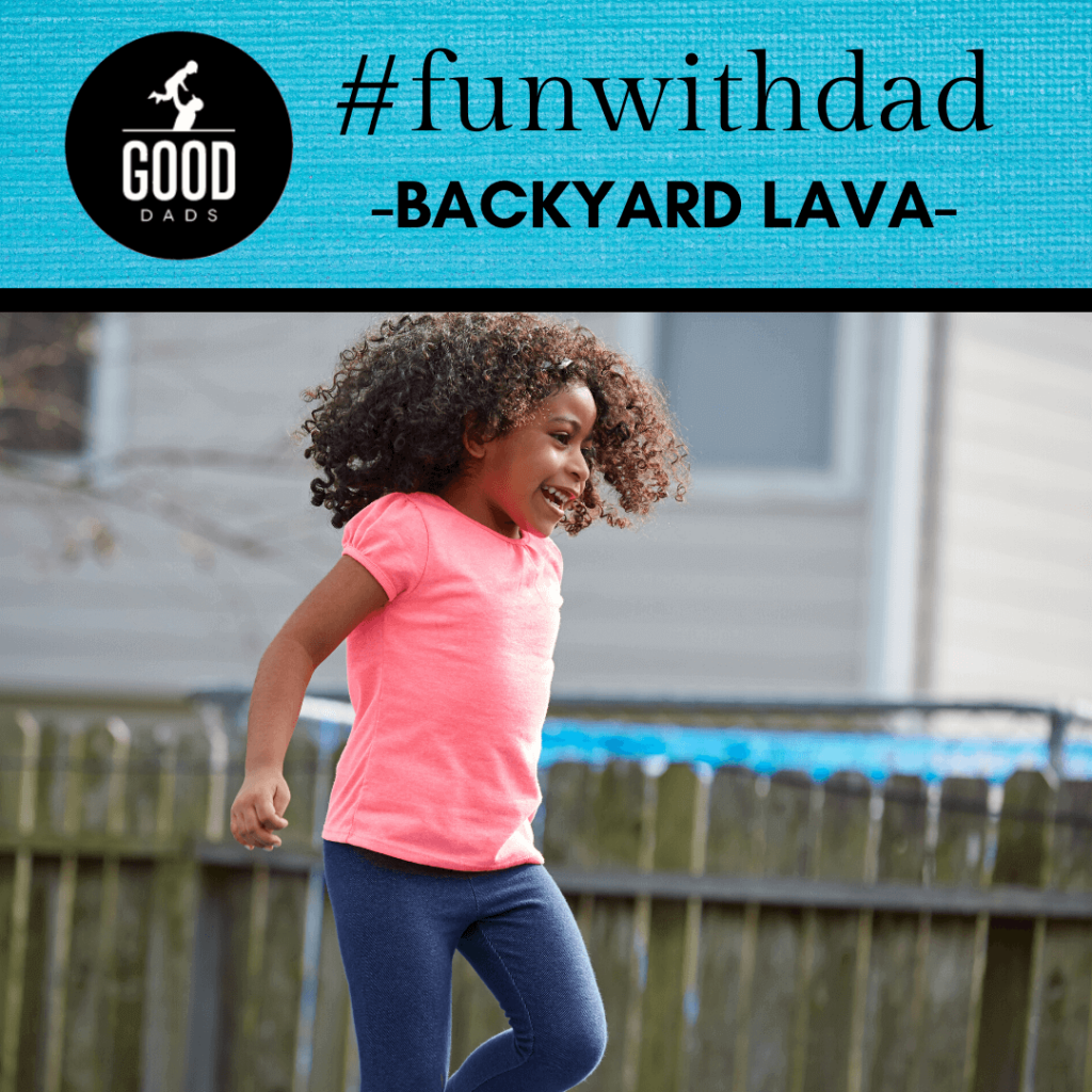 A small. happy girl jumps on a trampoline.