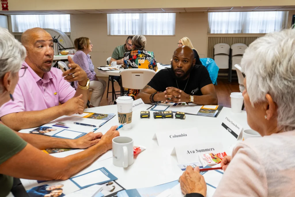 Attendees collaborate with one another to develop strategies to best reach the fathers in their communities on Wednesday, July 17.