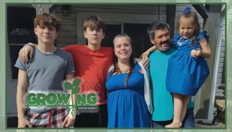 Michael, his wife, and his three children stand with their arms around each other outside of their home.