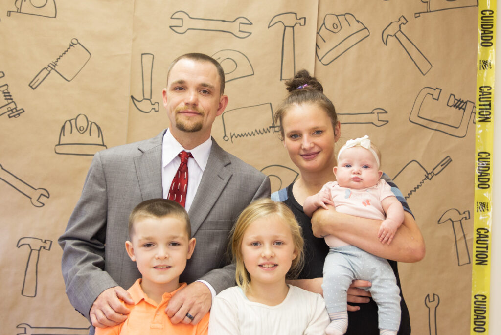 Michael Gray and his family smile for a group photo