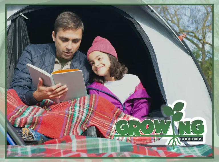 A happy dad and his daughter sit in a camping tent to read a book together.