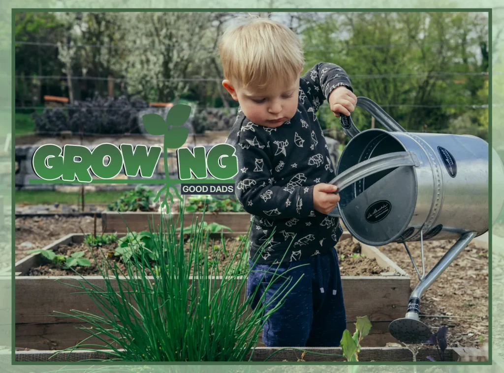 A young boy stands at a garden bed and waters the plants with a large, metal watering can.