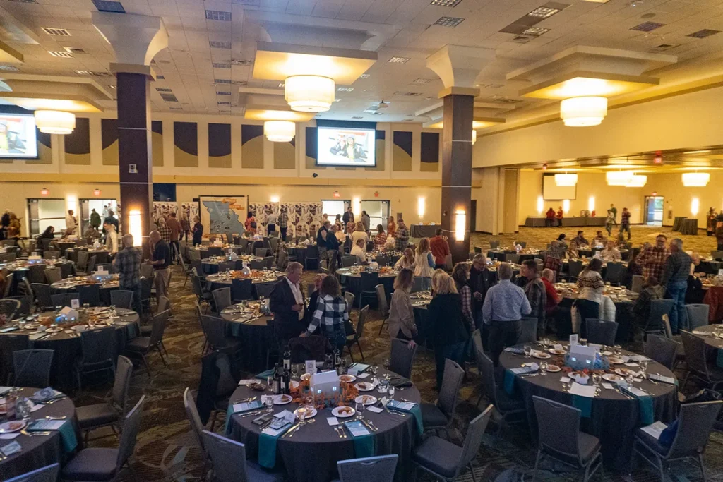 A wide-angle shot of the ballroom filled with guests