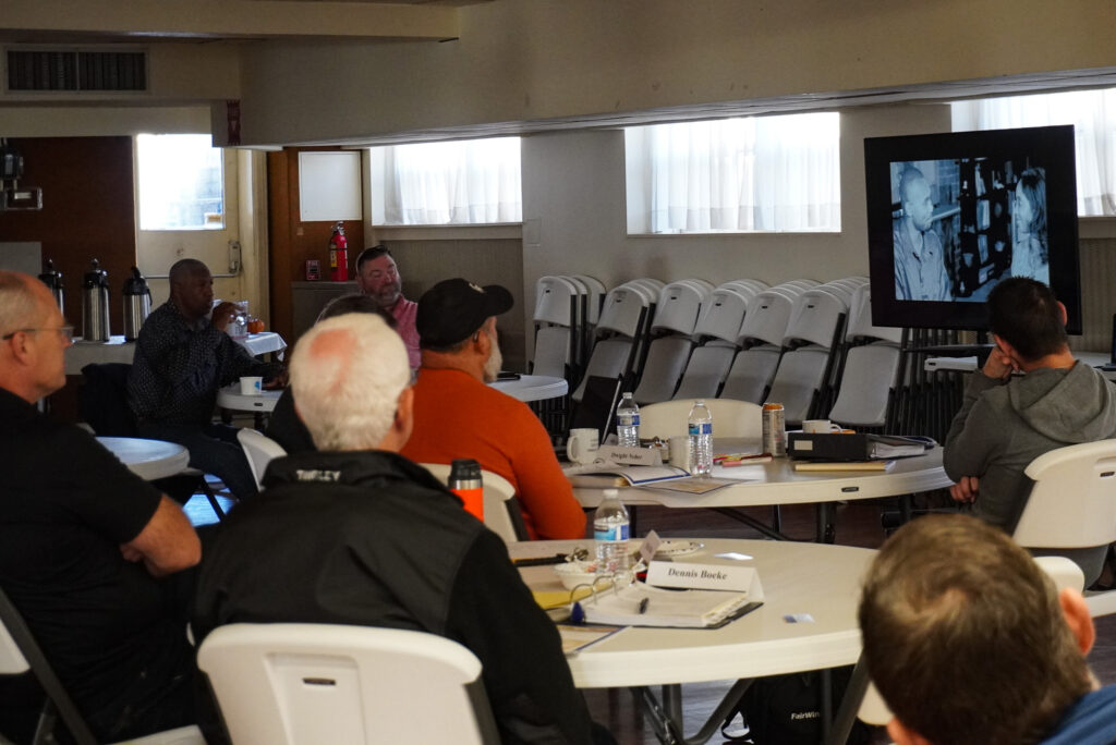 Attendees watch a video clip during the Good Dads training event.