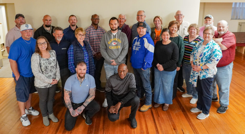 Facilitators smile for a group photo at training camp at the Downtown Church on Wednesday, Nov, 13, 2024.