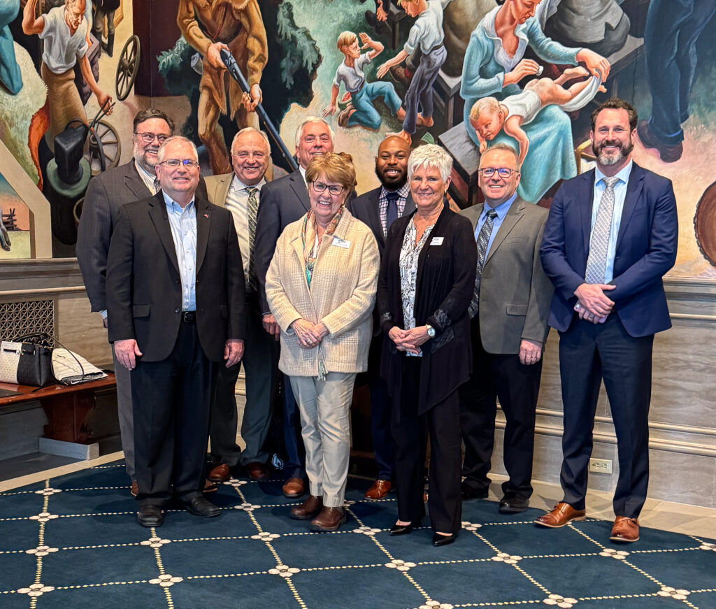 The Good Dads team smiles for a group photo at the state capital in January 2025.