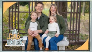 Brian Mattson, his wife, Jessica, and their two children, Jack and Dorothy, sit on a park bench and smile for a family photo.