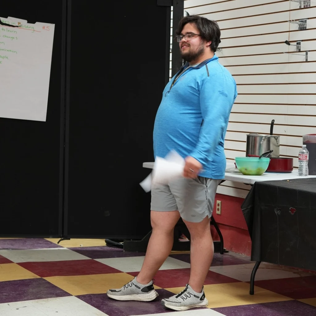 Good Dads Chillicothe leader and facilitator Cameron Schmitz stands at the front of a classroom to lead a Good Dads class