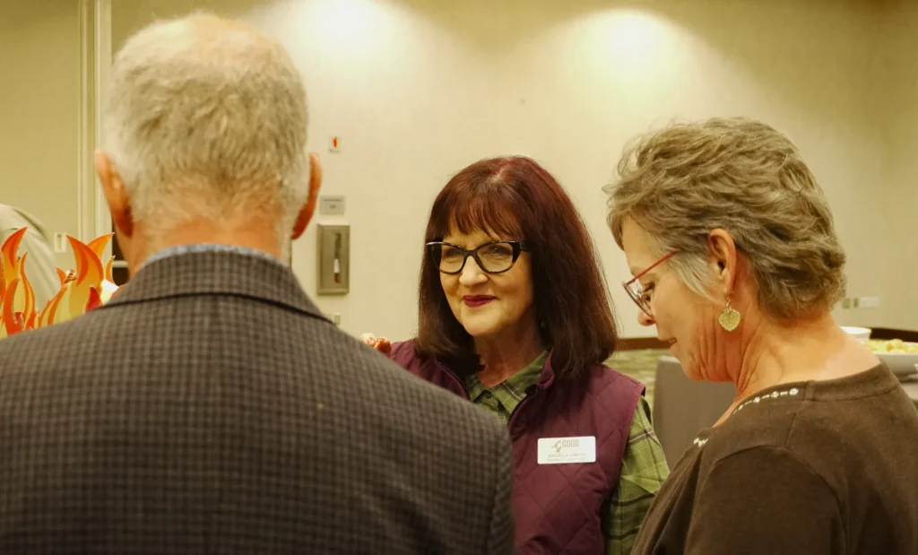 Good Dads board member Angela Smith smiles as the listens intently to an event guest.