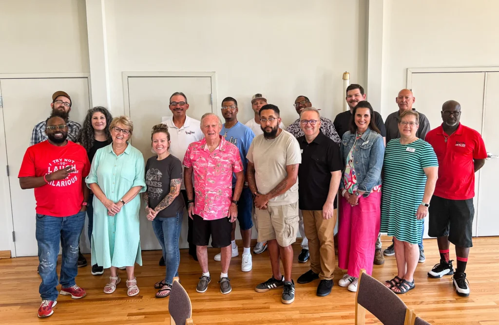 A group of happy Good Dads training camp attendees smile for a group photo in summer 2025 in the Kansas City, MO, area.