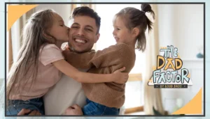 The Dad Factor: A smiling father holds his two young daughters