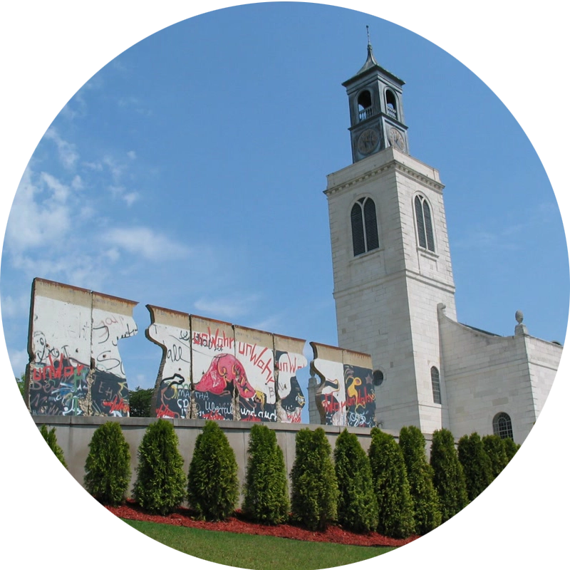 Exterior of Westminster College and America's National Churchill Museum, a white tower and mural wall in front of a bright, blue skyExterior of Westminster College and America's National Churchill Museum, a white tower and mural wall in front of a bright, blue sky