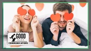 Good Dads Communicators: A man and woman lay side by side, paper hearts covering their eyes.