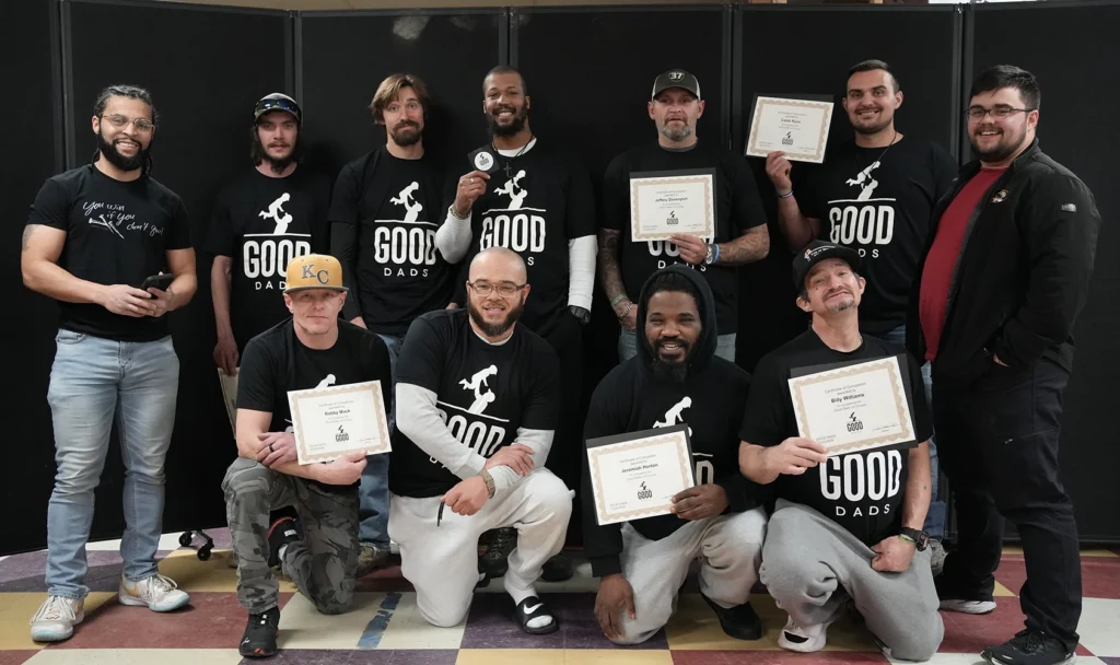 Good Dads participants pose for a group photo wearing their Good Dads t-shirts after the last evening of class in February 2026 in Chillicothe.