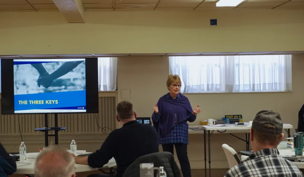 Good Dads founder and director Dr. Jennifer L. Baker addresses the room during facilitator training for Prep 8.0.