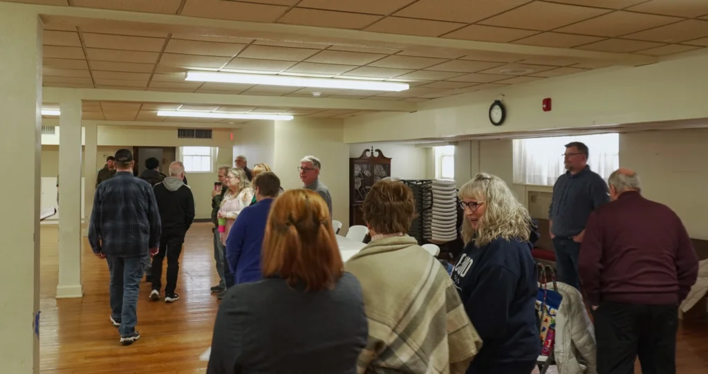 Facilitators line up on an imaginary line to indicate whether they agree or disagree with a values-based statement during a Fundamentals for Good Dads activity at the January 2026 Good Dads Plus Us Training Camp in Springfield MO.