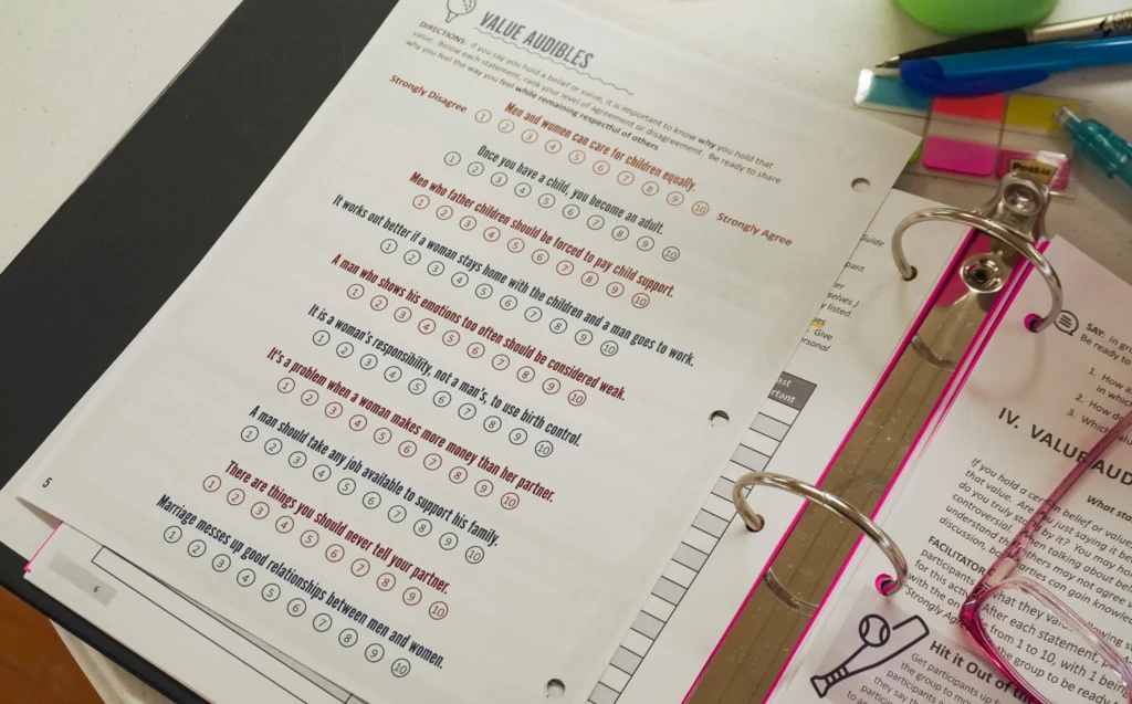 A close-up of a participant guide page in the Fundamentals for Good Dads curriculum: the activity prompts participants to mark whether they agree/disagree with a series of values-based statements