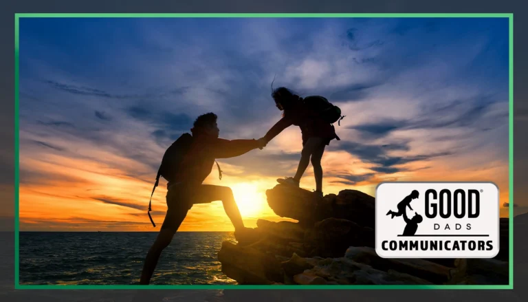 Good Dads Communicators: A sunset in the background, an outline of two figures, one on a higher level, helping the other figure up