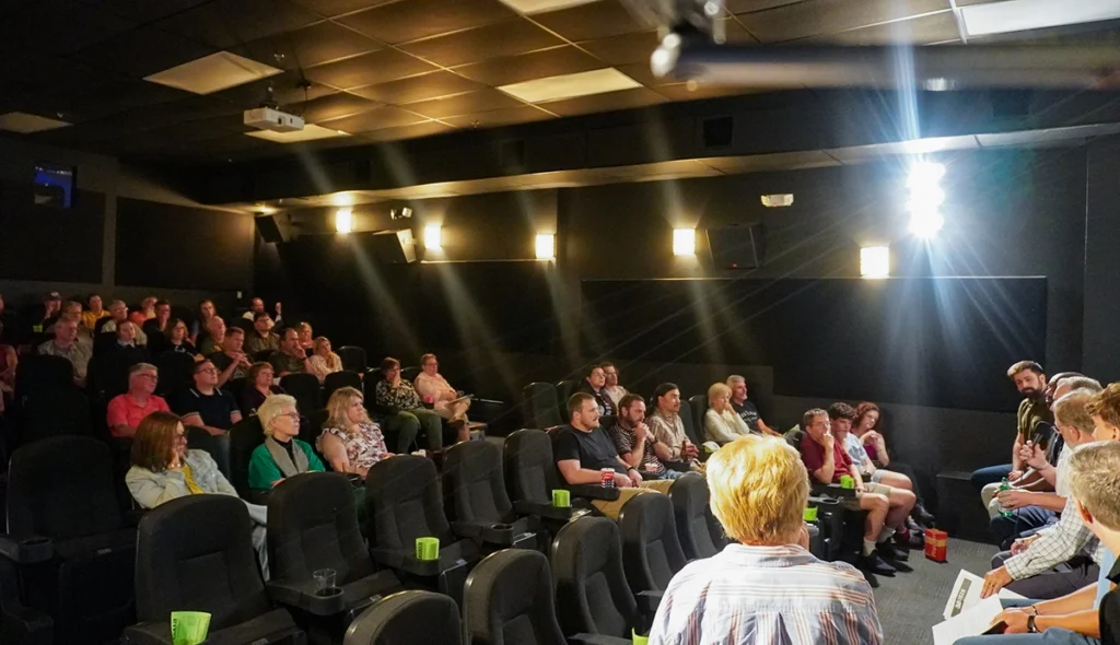 A wide-angle shot of theater attendees in their seats, listening to the panel following Good Dads' screening of the "Gone Guys" documentary on June 8, 2026, in Springfield, MO.