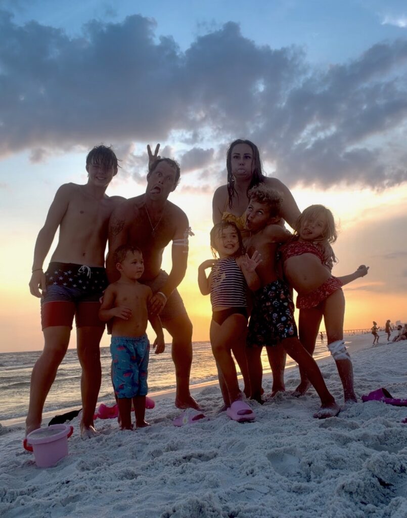 Dustin Libertus with family on the beach