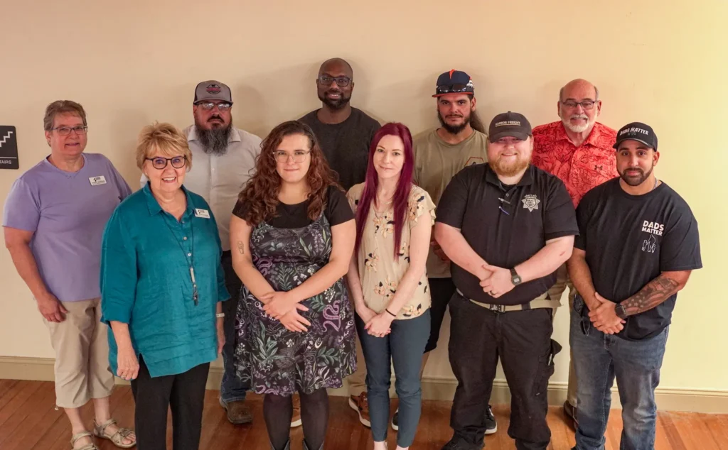 A group photo of nine people who attended Good Dads' Training Camp in September 2026.