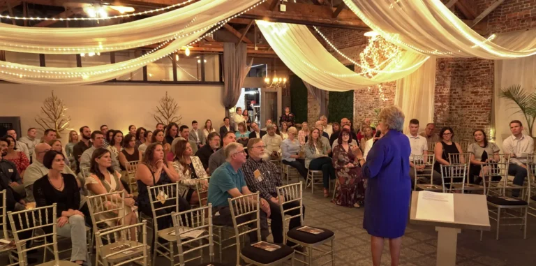 Guests during the September 2026 fall fundraising dinner for Good Dads listen intently during Dr. Jennifer L. Baker's presentation where she argues fathers are the key to great communities.