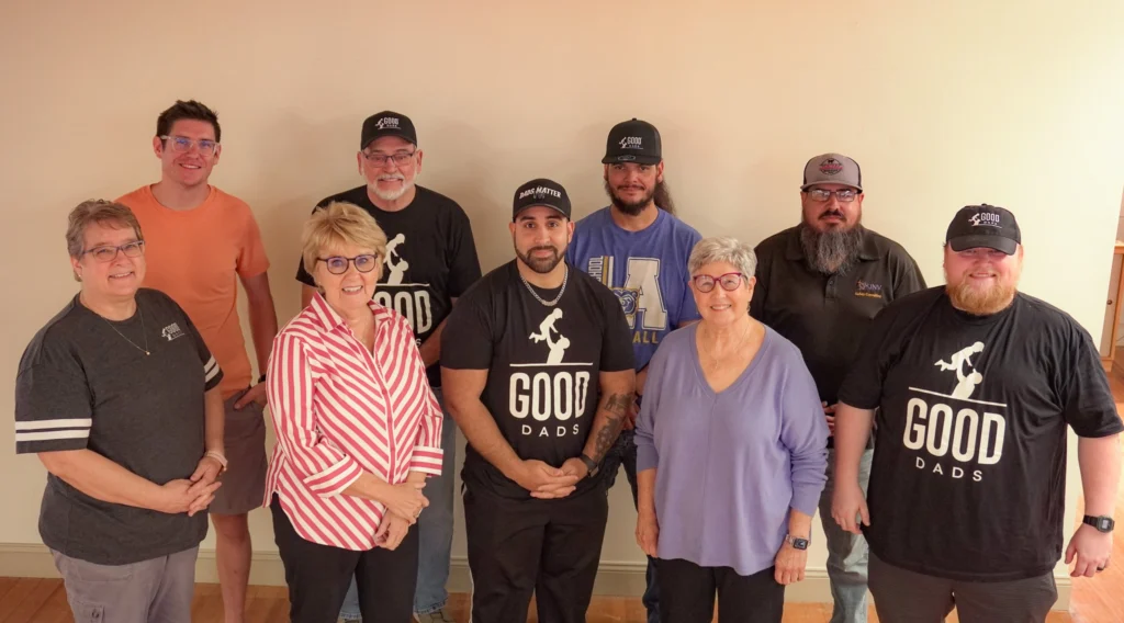 A group photo of nine people who attended Good Dads' Training Camp in September 2026.