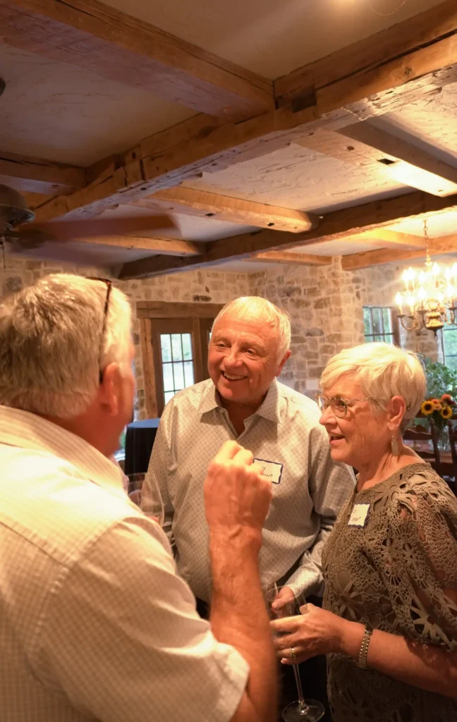 Good Dads executive board member Benjy Lampert and wife Lori, mingle at an evening reception to celebrate the nonprofit's outcomes, at the home of a Good Dads board member, in October 2026.
